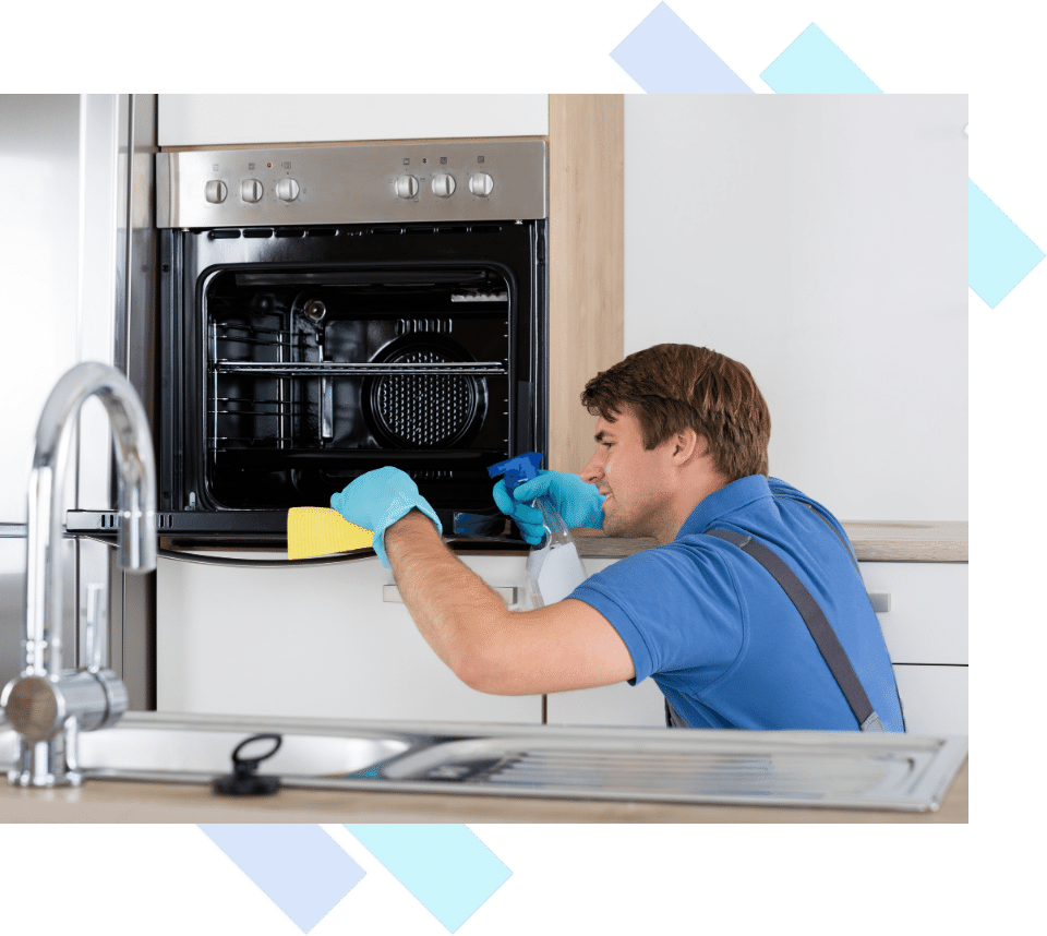 Professional cleaner using a special product to clean an oven