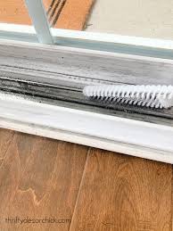 Cleaning Window sill with a brush